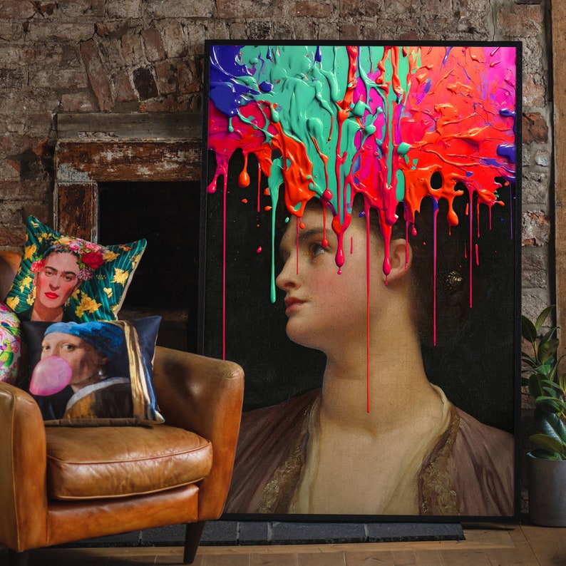 May include: A framed painting of a woman with colorful paint splatters on her head. The paint is dripping down her face and shoulders. The woman is looking to the side with a serious expression. The background is black.