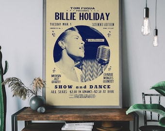 May include: A framed vintage poster advertising a Billie Holiday show. The poster features a blue and cream color scheme with the text "Billie Holiday" prominently displayed. The poster also includes the date, location, and other performers.