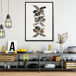 May include: A framed print of a stylized illustration of a branch with leaves and apples. The apples are replaced with skulls and eyes. The background is white.