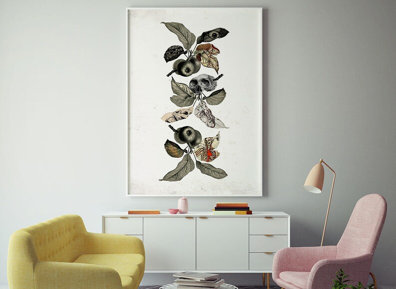 May include: A framed collage of a stylized apple tree with leaves, apples, and anatomical illustrations. The artwork is in black, white, and red tones and is displayed on a white wall above a white dresser.