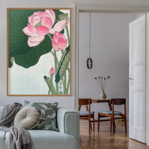May include: A framed print of a Japanese-style illustration of pink lotus flowers with green leaves. The print features the Japanese characters "蓮華" (renka) which means "lotus flower".