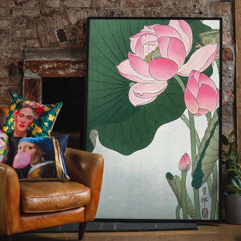 May include: A framed print of a Japanese-style illustration of a pink lotus flower with green leaves. The print is on a white background and has Japanese text in the bottom right corner.