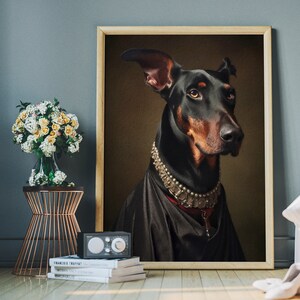 May include: A black and brown Doberman Pinscher dog wearing a silver and pearl necklace, with a black velvet background.