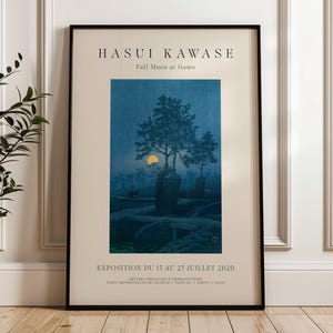 May include: A black framed poster with the text "HASUI KAWASE Full Moon at Gamo" and an illustration of a moonlit forest scene with a single tree in the center. The text "EXPOSITION DU 13 AU 23 JUILLET 2020" is at the bottom of the poster.
