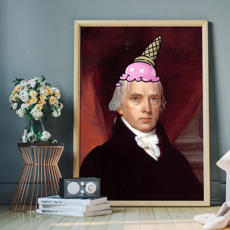 May include: A framed portrait of a man with a pink ice cream cone on his head. The man is wearing a black suit and white shirt. The background is a red curtain.