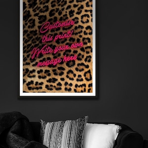 May include: A framed print with a leopard print background and pink text that says "Customise this print! Write your own message here."
