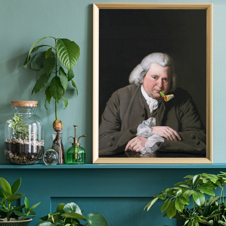 May include: A framed portrait of a man wearing a brown jacket and a white shirt. He is holding a party favor in his mouth. The background is a dark green color.
