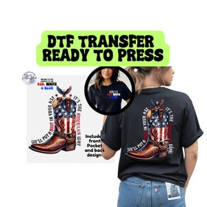 May include: Black t-shirt with a patriotic design featuring a cowboy boot with the American flag, an eagle, and the text "We'll put a boot in your ass. It's the American way." Includes front pocket and back design.