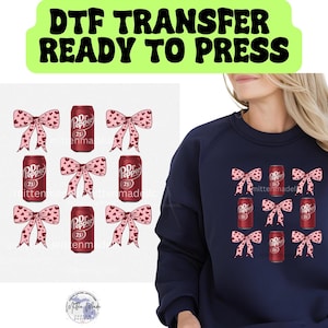 May include: A digital transfer design featuring nine images of Dr Pepper soda cans with pink bows. The design is ready to be pressed onto a t-shirt or other fabric.