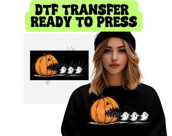 May include: Black sweatshirt featuring a Halloween-themed graphic. The design includes an orange jack-o'-lantern with a jagged mouth and three white ghosts. The text "DTF TRANSFER READY TO PRESS" is at the top in a green banner.