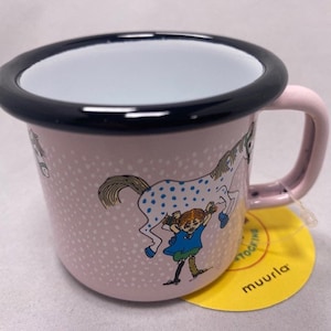 May include: Pink enamel mug with a black rim and a white interior. The mug features a colourful illustration of a girl riding a spotted horse. The text "muurla" is printed on the bottom of the mug.