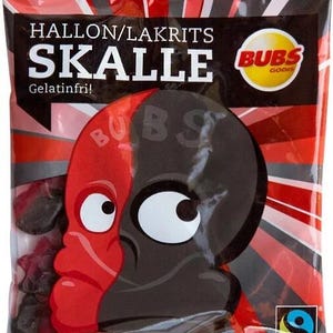May include: A bag of red and black candy with the text "Hallon/Lakrits Skalle Gelatinfri!" and a logo for "Bubs Godis" with a skull illustration. The bag also has a Fairtrade logo.