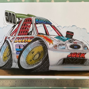 May include: A white cartoon race car with the number 900 on the side and the word "JOCK" on the front. The car has a red, white and blue paint scheme and is surrounded by a white cloud.