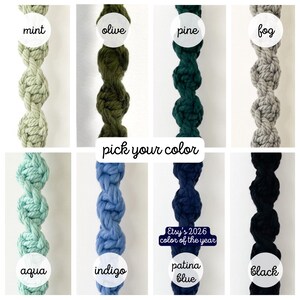 May include: Close-up of eight knotted macrame plant hanger samples in various colors. Colors include mint, olive, pine, fog, aqua, indigo, patina blue, and black. Text reads "pick your color" and "Etsy's 2026 color of the year."