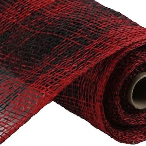 May include: Red and black buffalo plaid mesh ribbon. The ribbon is rolled up and the texture of the mesh is visible.