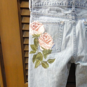 Stunning Hand Painted Roses on the back side of distressed Hco Flare Pants by Artist Size 5R