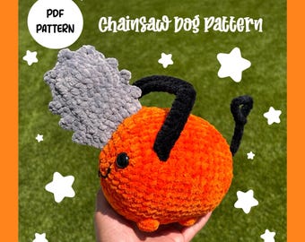 May include: A crocheted orange and gray chainsaw dog plush toy. The toy has a black handle and a gray chainsaw blade. The toy is sitting on a green grassy surface.