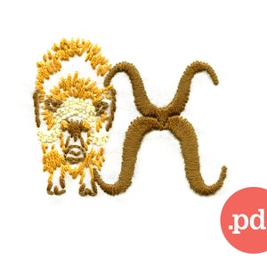 May include: Embroidered design featuring a bison and the Taurus astrological symbol in shades of gold, brown, and cream. The design is on a white fabric background. A red circle with the text ".pdf" is in the lower right corner.