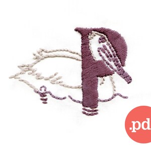 May include: Embroidered design of a pelican with the letter "P" in purple thread. The pelican is stitched in beige thread and is sitting on a wave. The design is on a white background.