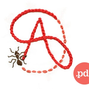 May include: Red embroidered letter A with a small brown ant crawling on the letter. The ant is walking on a red thread that is part of the letter. The letter is surrounded by a dotted line of red thread.
