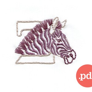 May include: Embroidered letter Z with a purple and white zebra design. The zebra's head is facing right and the letter is outlined in beige thread.