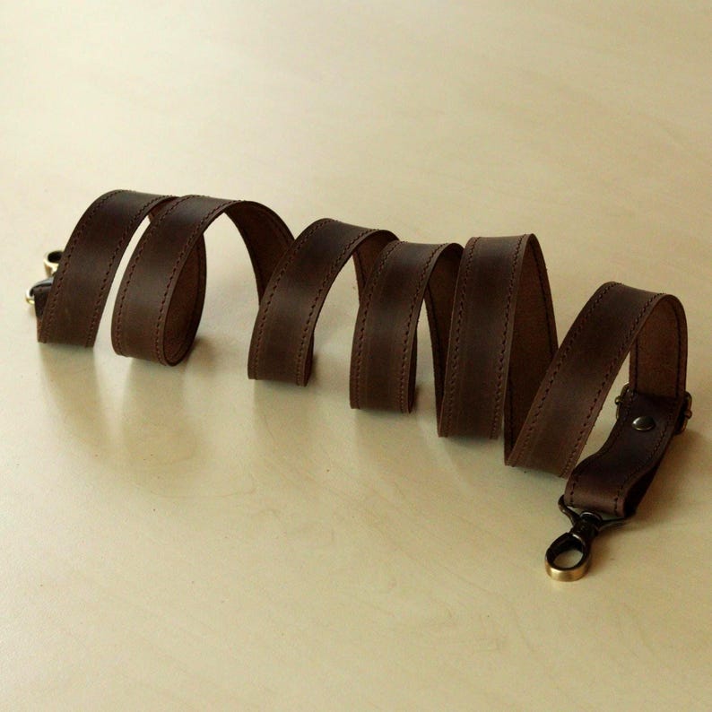 This wide strap is made of high quality genuine Crazy Horse leather. It is durable and reliable, and has a matte fine grain finish that takes on a vintage look over time.