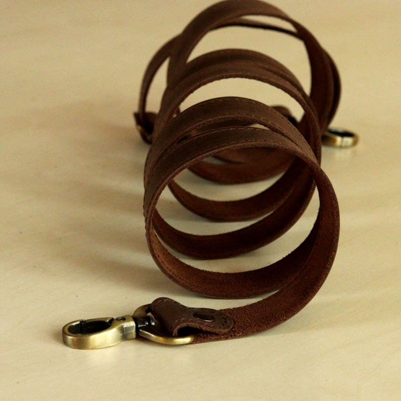 This wide strap is made of high quality genuine Crazy Horse leather. It is durable and reliable, and has a matte fine grain finish that takes on a vintage look over time.