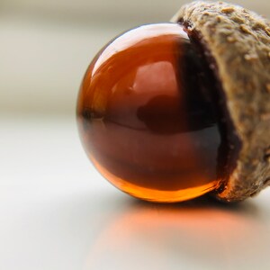 Dark amber glass acorn decorations