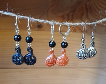 Cute little hanging earrings in the shape of a Halloween pumpkin