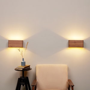 2 rechargeable battery-operated wall sconces in walnut