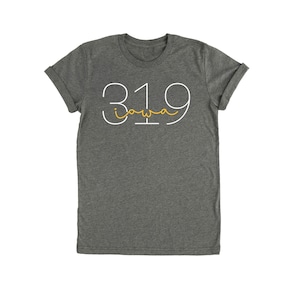 May include: A dark gray t-shirt with a white graphic of the number 319 with the word "iowa" written inside the number in yellow.