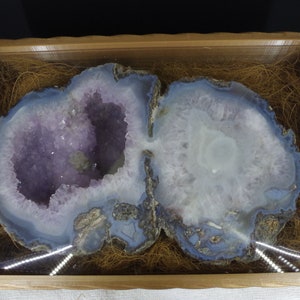 Double cavity Geode Pair with quartz and amethyst, surrounded by banded agate in an elegant display box.