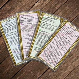 May include: Four gold-trimmed cards with images of angels and text about their feast days, names, and patronages. The cards include Saint Michael, Saint Raphael, Saint Uriel, and Saint Gabriel.