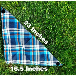 May include: A blue and white plaid bandana with orange accents. The bandana is 23 inches long and 16.5 inches wide.