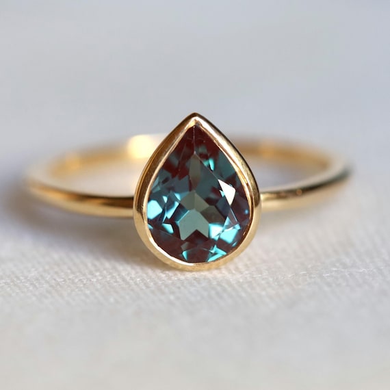 Lab Alexandrite Ring: Pear Cut, 14k Gold Bezel Setting