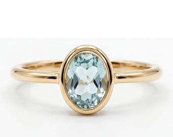 Aquamarine Engagement Ring: Oval Cut, 14k Gold Bezel - Minimal Style