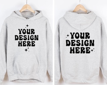 May include: A light gray hooded sweatshirt featuring the black text YOUR DESIGN HERE in a bold, wavy font on both the front and back. The design includes small four-pointed star accents above and below the text on the front and sides.