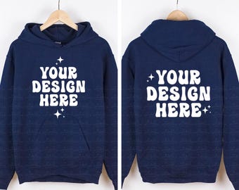 May include: A navy blue hooded sweatshirt featuring the white text "YOUR DESIGN HERE" in a bold, rounded font on both the front and back. The design includes small white four-pointed star accents above and below the text on both sides.