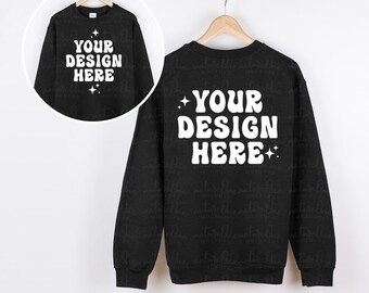 May include: A black crewneck sweatshirt featuring the white text "YOUR DESIGN HERE" in a bold, wavy font, accented by small four-pointed stars. A circular inset shows the same sweatshirt design, providing a view of the front and back.