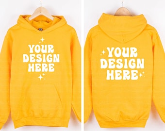 May include: A bright yellow hooded sweatshirt featuring the white text YOUR DESIGN HERE in a wavy font on both the front and back. The design includes small four-pointed star accents above and below the text on the front and sides.