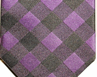 May include: A purple and black patterned tie with a diamond pattern.