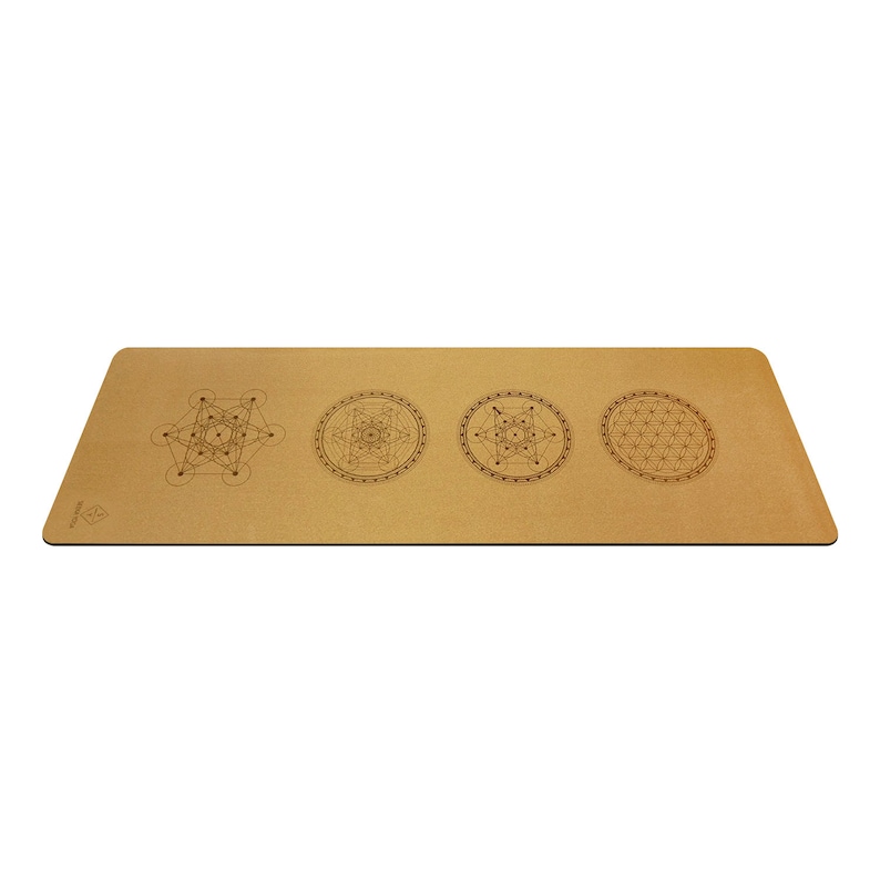 May include: A brown cork yoga mat with four geometric designs printed on it. The designs are in black and white and include a flower of life, a metatron's cube, and a seed of life.
