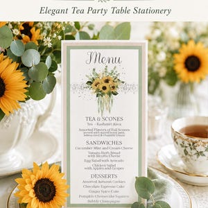 May include: A vertical menu card featuring a watercolor illustration of sunflowers and eucalyptus leaves with a lace border. The text lists tea, scones, sandwiches, and desserts including pumpkin cheesecake squares and bubbly champagne.