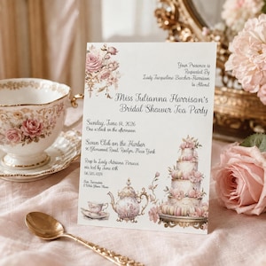 May include: A white rectangular bridal shower invitation card featuring pink rose illustrations, a tiered cake, and a teapot. The text reads: Your Presence is Requested By Lady Jacqueline Beecher-Harrison to Attend Miss Julianna Harrison's Bridal Shower Tea Party.