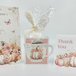 May include: A bridal shower invitation with a pink and white floral design featuring pumpkins and butterflies. The invitation reads "Join Us for Tea to Celebrate Stephanie Mahomme's Bridal Shower".