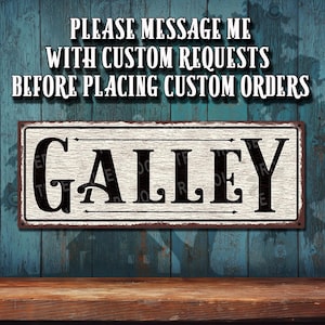 May include: A rectangular metal sign with the word "GALLEY" in bold black letters. The sign has a distressed, vintage look with a white background and a brown border. The text "PLEASE MESSAGE ME WITH CUSTOM REQUESTS BEFORE PLACING CUSTOM ORDERS" is above the sign.