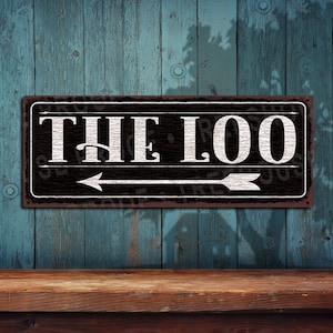 The Loo Metal Sign: Arrow Pointing Left • Rustic Looking Full Color Imprint on Rustproof Aluminum THC2618-A