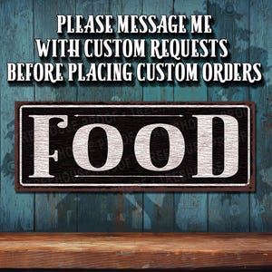 May include: A rectangular metal sign with a black background and a white border featuring the word FOOD in large white capital letters. Above the sign, the text reads PLEASE MESSAGE ME WITH CUSTOM REQUESTS BEFORE PLACING CUSTOM ORDERS.
