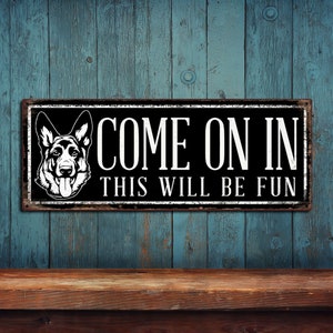 May include: Black and white metal sign with a German Shepherd dog head and the text "Come on in this will be fun".