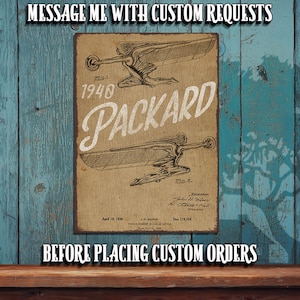 May include: A vintage-style sign featuring a 1940 Packard car design. The sign is printed on a tan background with the word "PACKARD" in a white, stylized font. The text "MESSAGE ME WITH CUSTOM REQUESTS" and "BEFORE PLACING CUSTOM ORDERS" are also visible.